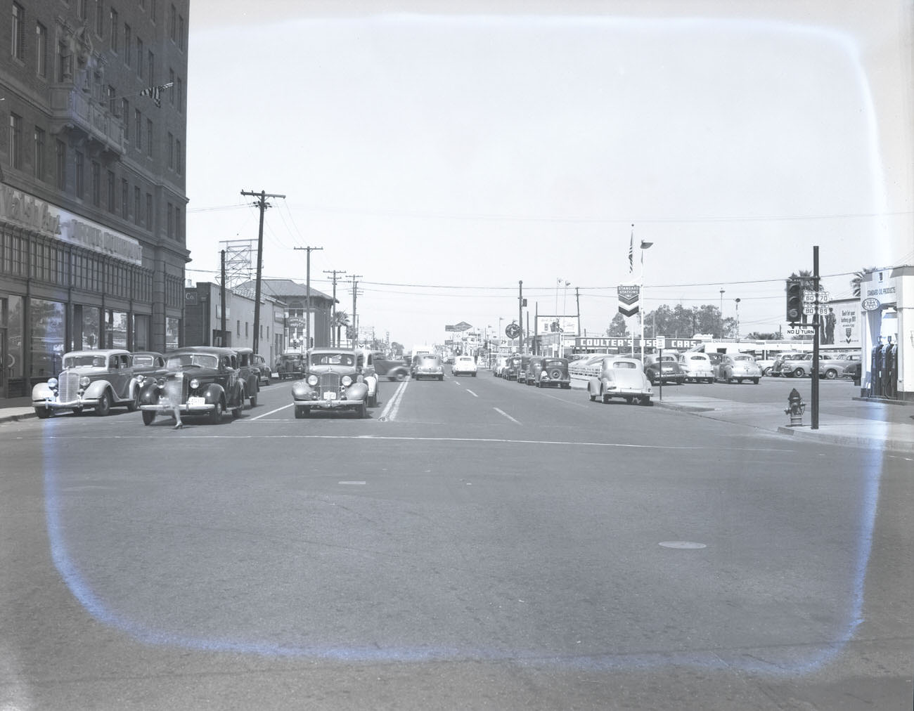 #28 Intersection of W. Van Buren St. and Central Avenue, 1942. Office Equipment, Coulter’s Used Cars (312 N. Central) and Western Auto Supply (247 N. 1st Ave) are visible