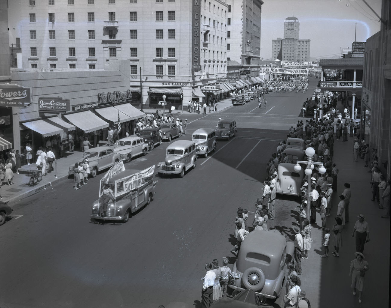 #5 U.S. Bond Parade, 1942. The parade is moving south on Central Ave. at the intersection of Central Ave. and W. Monroe St.