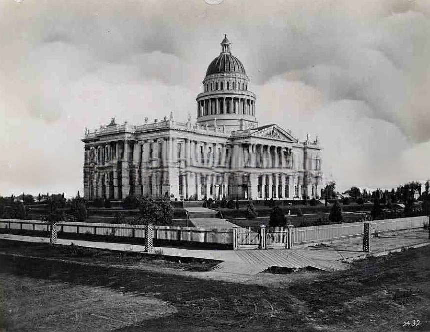 #67 Exterior view of the first machine shop of the Central Pacific Railroad Company, 1876