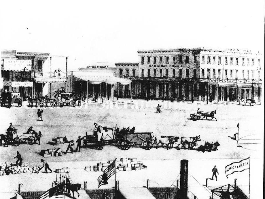 #146 An old drawing of Old Sacramento with busy pedestrians. Gardner House, National House, and G. O. Perry Co. visible, 1875