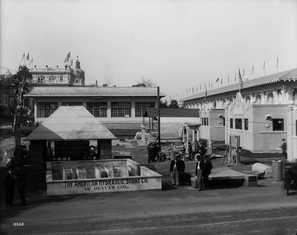 #215 The American Hydraulic Stone Company, Denver, Colorado, exhibited machinery used for making hollow concrete walls and partitions in an outdoor space east of the Palace of Liberal Arts at the Louisiana Purchase Exposition