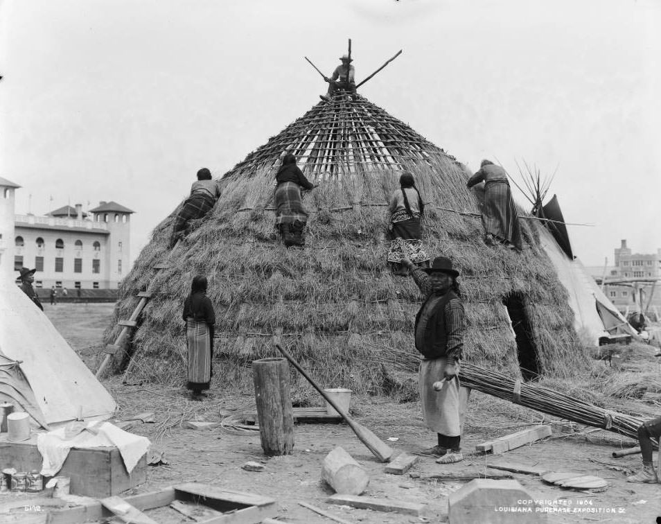 #77 Wichita Indian women build a grass lodge in the Native American section of the Anthropology exhibits at the Louisiana Purchase Exposition, the 1904 St. Louis World’s Fair.