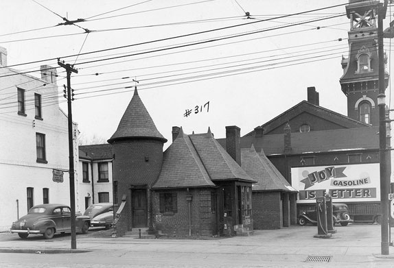 #114 A Joy Oil gas station earmarked for demolition at Dundas and Parliament prior to construction of Regent Park, 1940s