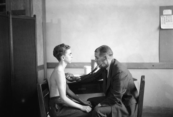 #140 Doctor performs a routine health examination at a Toronto school, 1940s