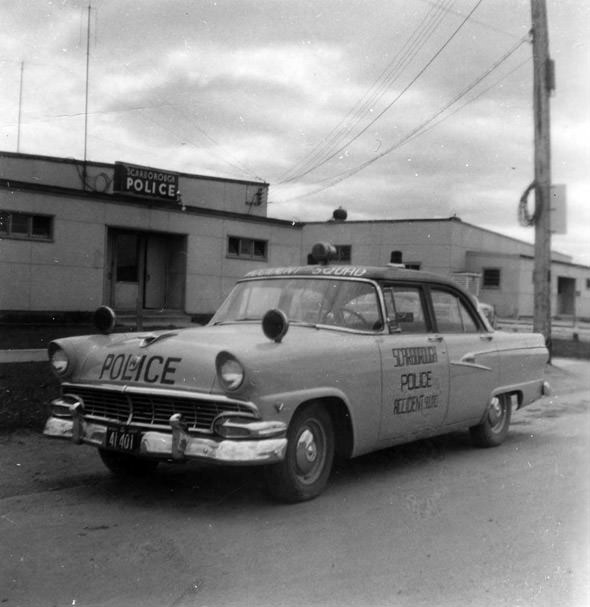 #153 A police car, 1950s
