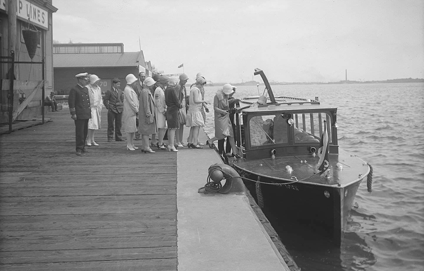 #129 An excited group boards the Miss York motor launch for a tour through the lagoons of Toronto Island, July 29, 1929.