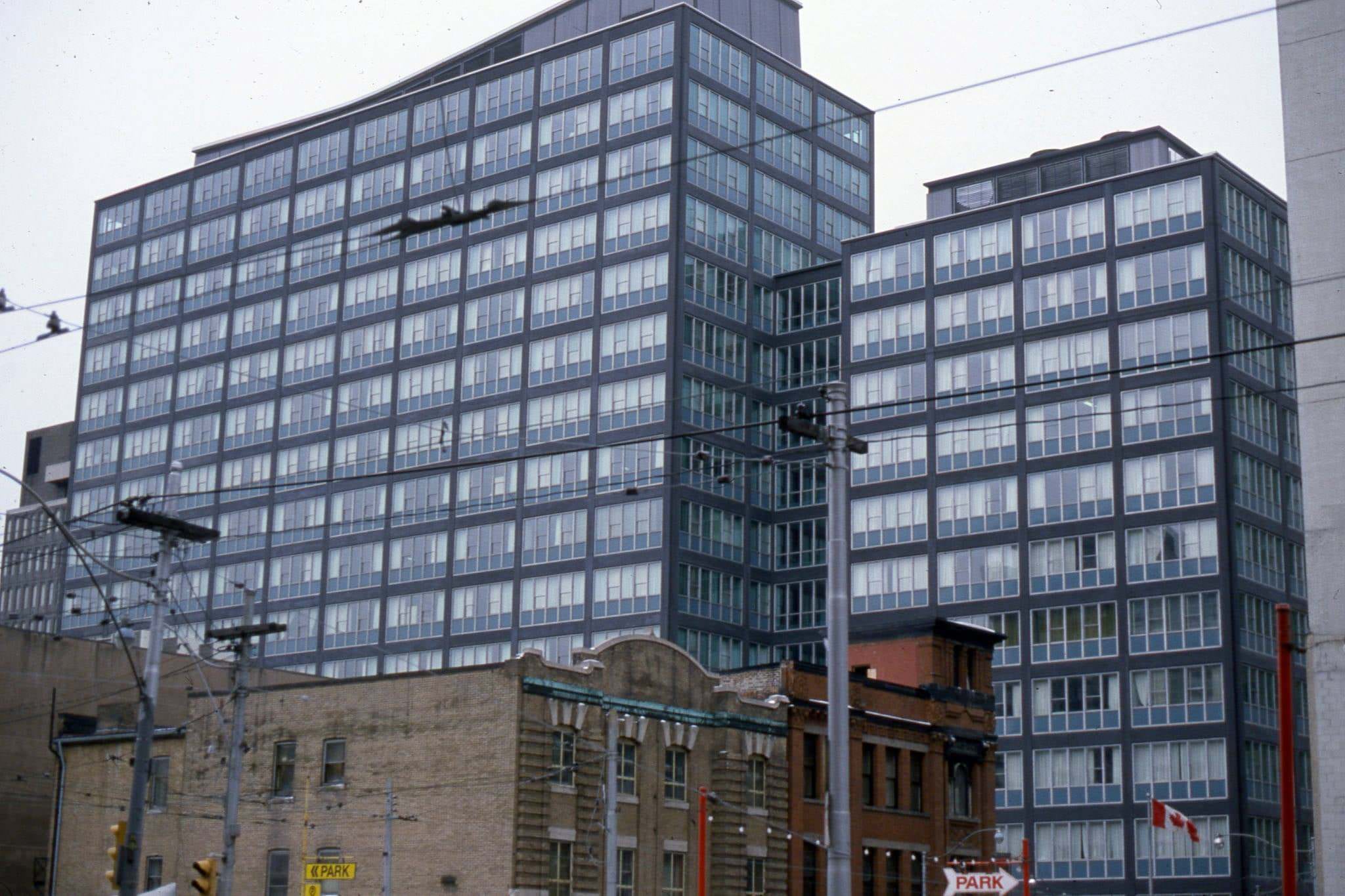 #58 View looking south east from Victoria St., to Lombard Ave. The grey building in the background is 30 Adelaide St. E., 1982