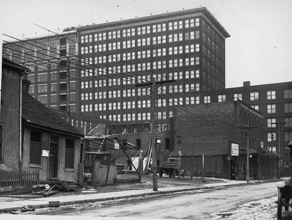 #97 View looking east on Louisa St. to James St., the T. Eaton factory looming in the distance, 1920