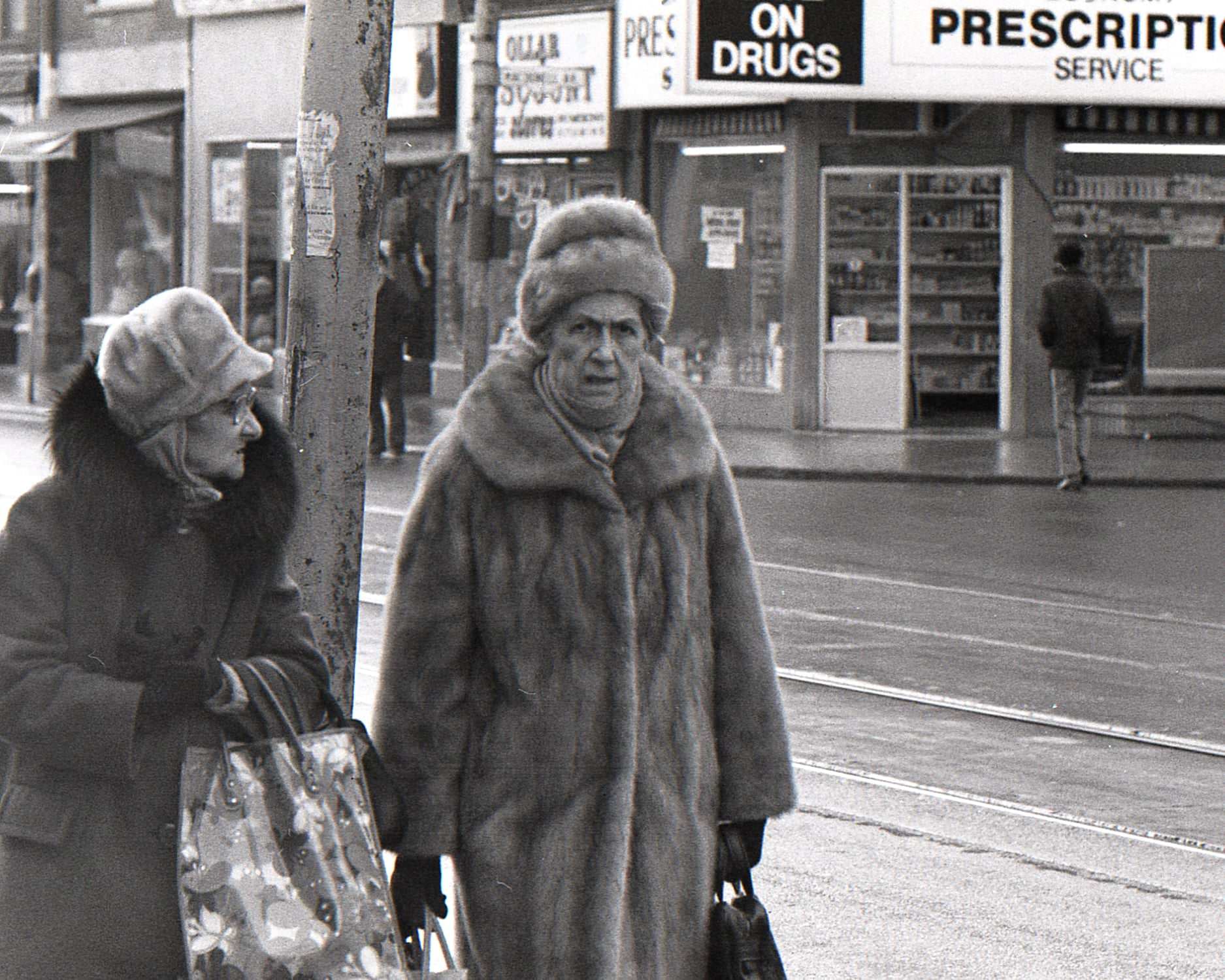 #168 An old parking meter and the newspaper box on Queen St. W. near Jameson Ave, 970s