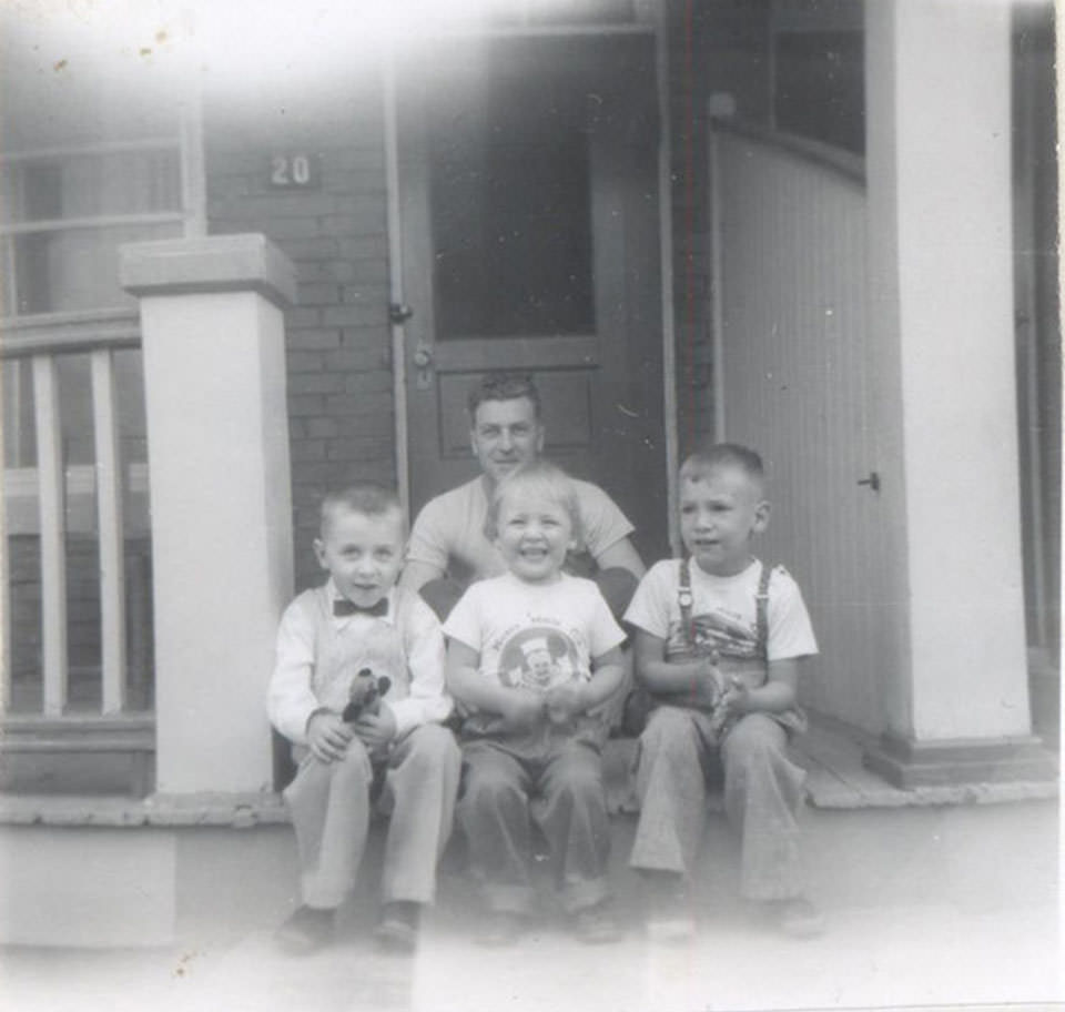 #103 Front – Tim McNeill, Janet (Wolkowski) Soucie, Brian Wolkowski. Back – Uncle Victor Wolkowski. We are on the veranda of 20 Royal St., 1957