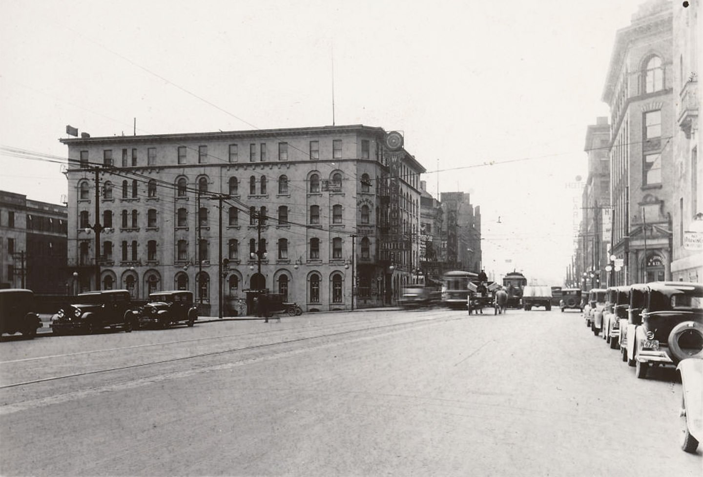 #110 View looking west on Front St. W., towards York St., 1929. The Walker House Hotel stands prominently to left of photo.