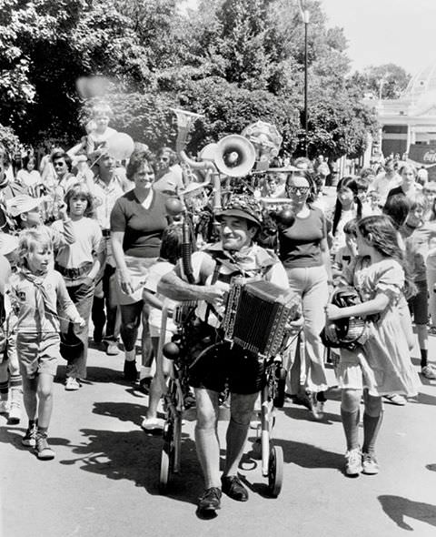 #127 This man would roam and play all these instruments at the same time at the CNE, 1975