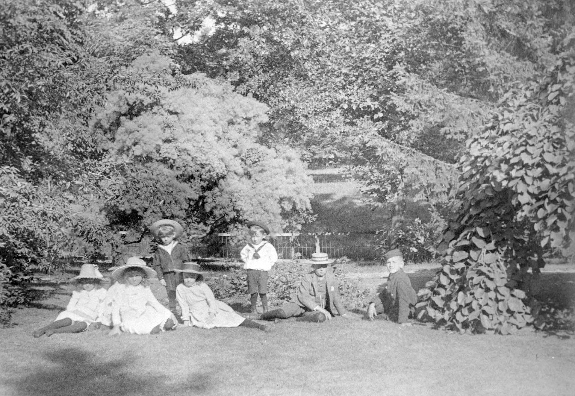 #79 Children lounging in the yard. Beatty, William H., house, Queen’s Park Cres. W., north of College Street, 1900.