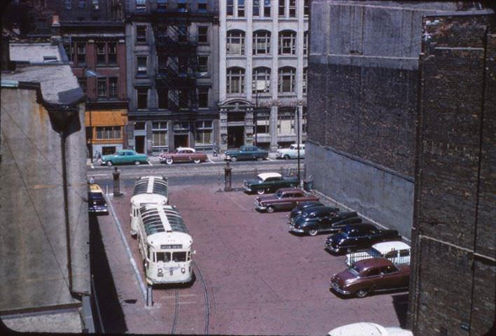 #134 Early 50s TTC Gray coach Sightseeing busses in laneway behind 35 yonge st, ttcs old head officetill 1958