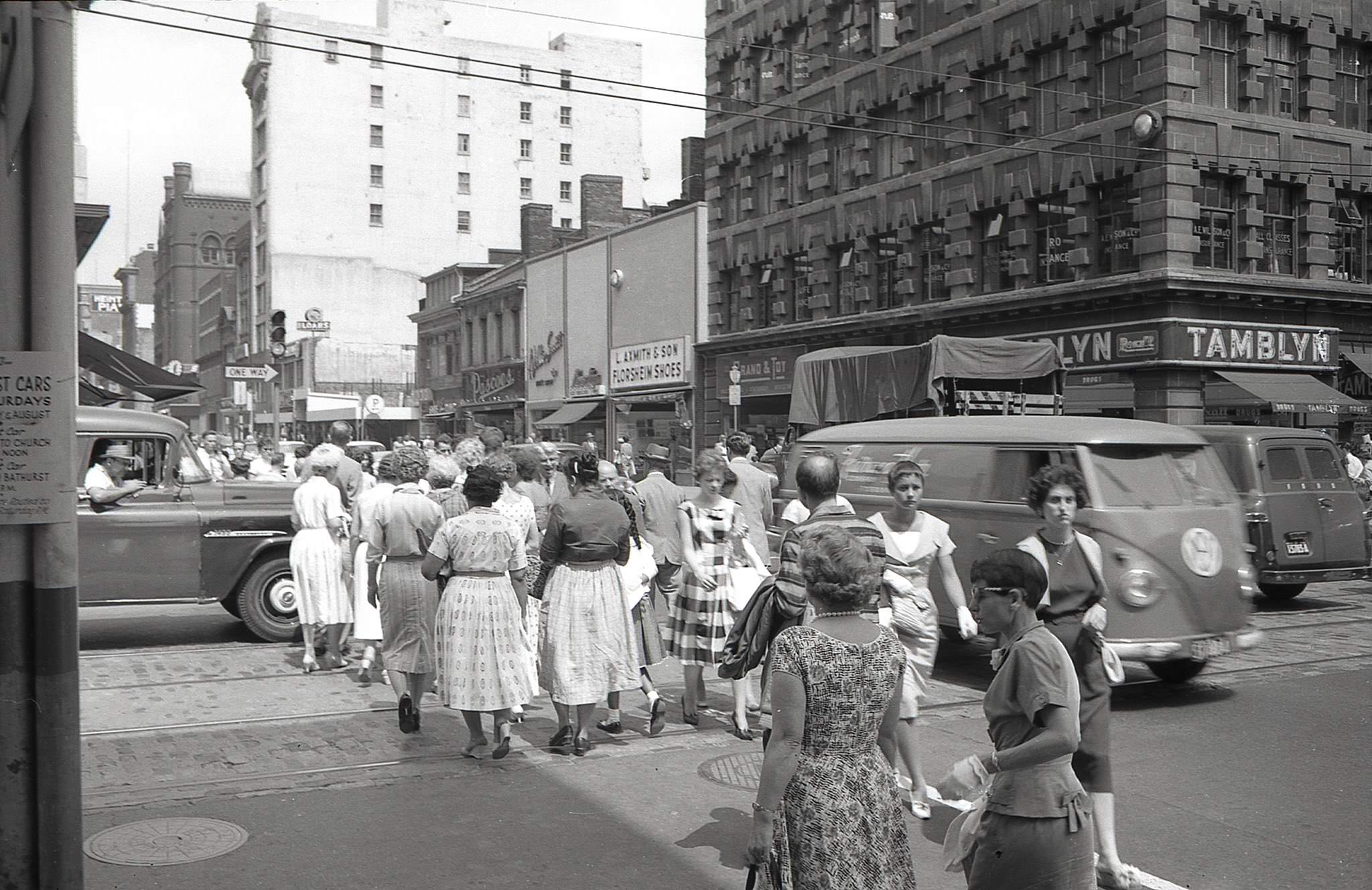 #74 Yonge and Adelaide, looking across the intersection towards the distinctive concrete exterior of the Lumsden Building, 1970s