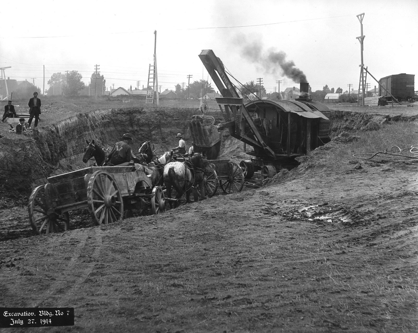 #11 Workers in horse-drawn buggies excavate building 7 of Kodak Heights, Mount Dennis, Toronto. (Eglinton Ave. W. & Weston Rd.), July 27, 1914