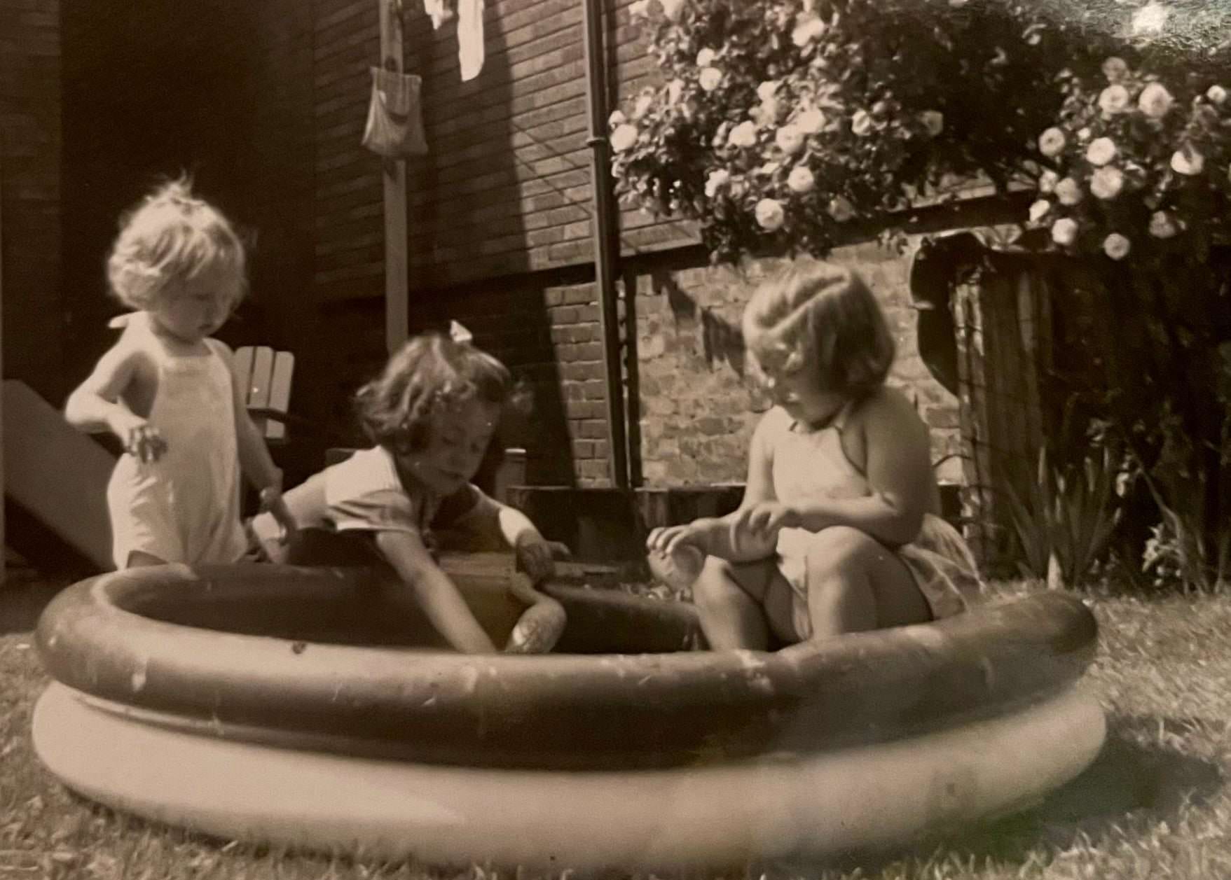 #37 Playing in the backyard pool, 1950s