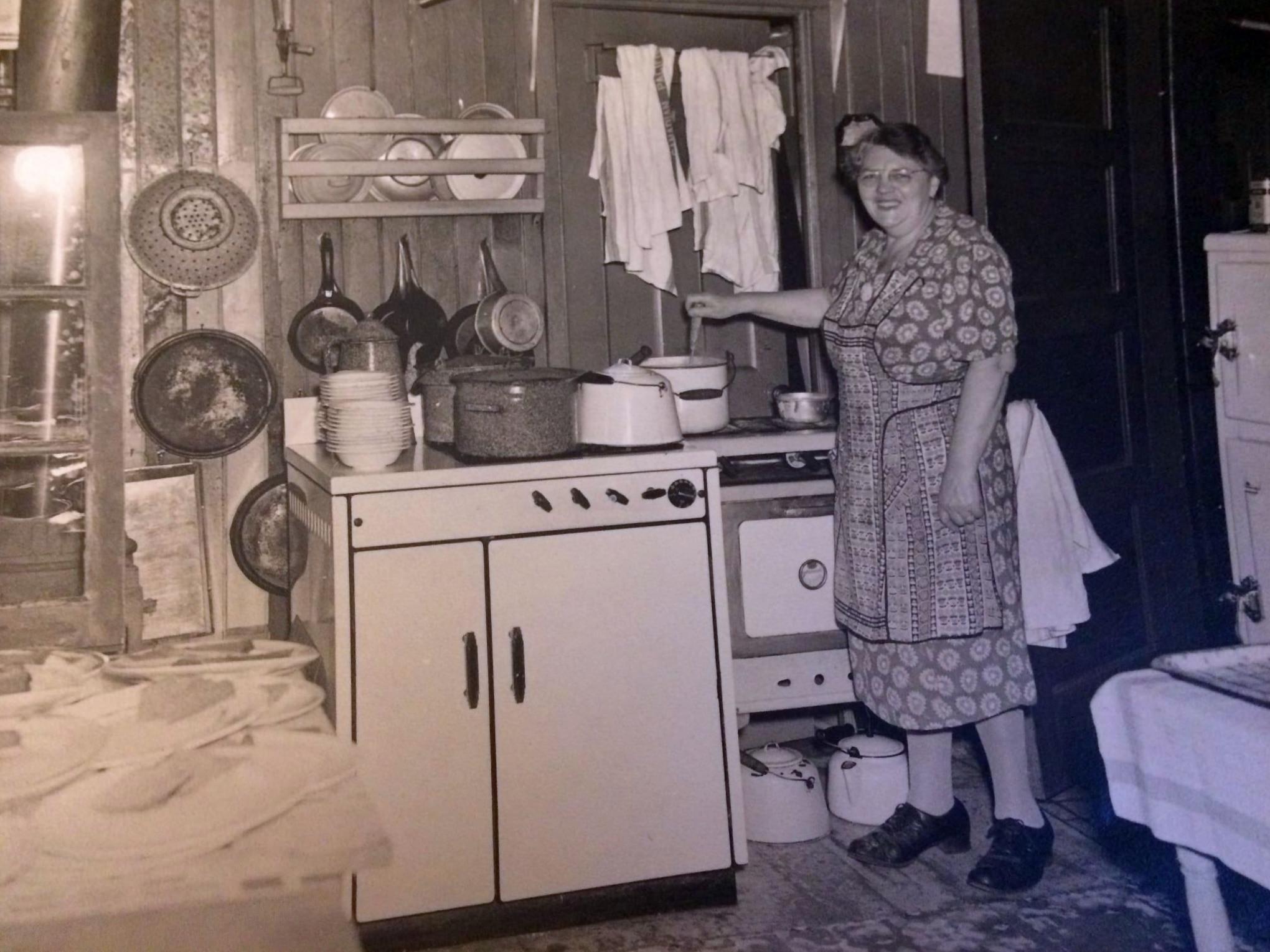 #42 A woman in her kitchen on Toronto Island around the 1940