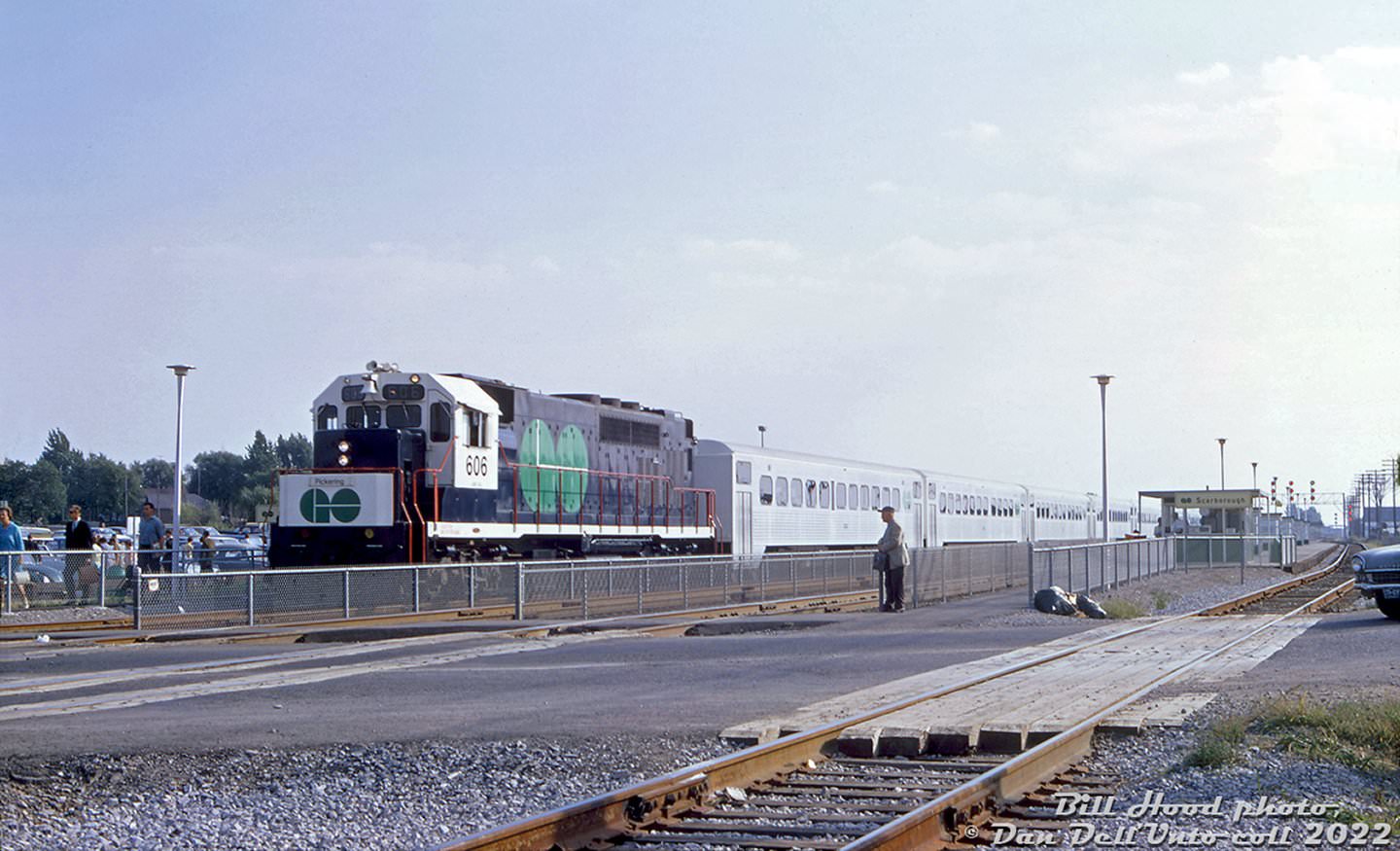 #10 GO locomotive GP40TC #606 heads an eastbound train out of Scarborough GO station about to cross the busy St. Clair Ave. E. grade crossing in September of 1967, during the first few months of GO train operation.