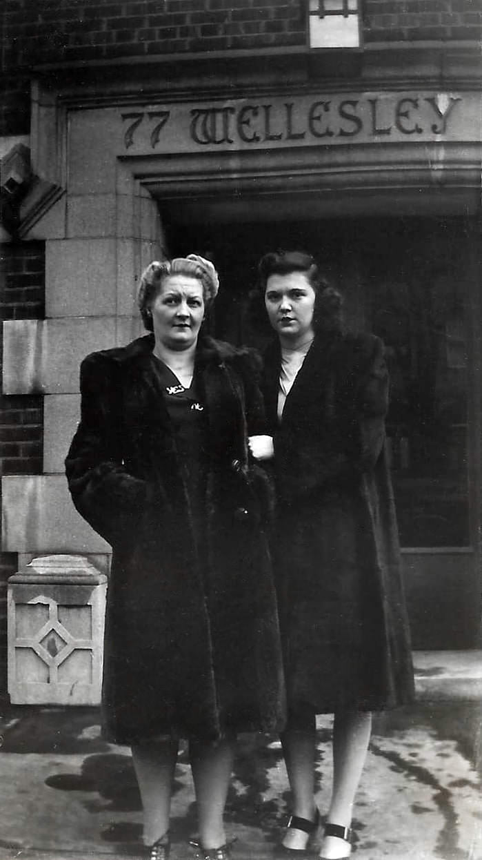 #152 Two women at 77 Wellesley St. E., near Church St., 1945