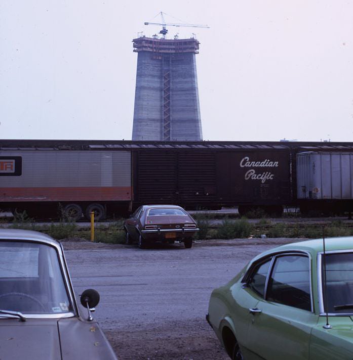 #92 CN Tower – construction view from King St W, in front of the Royal Alex, 1974