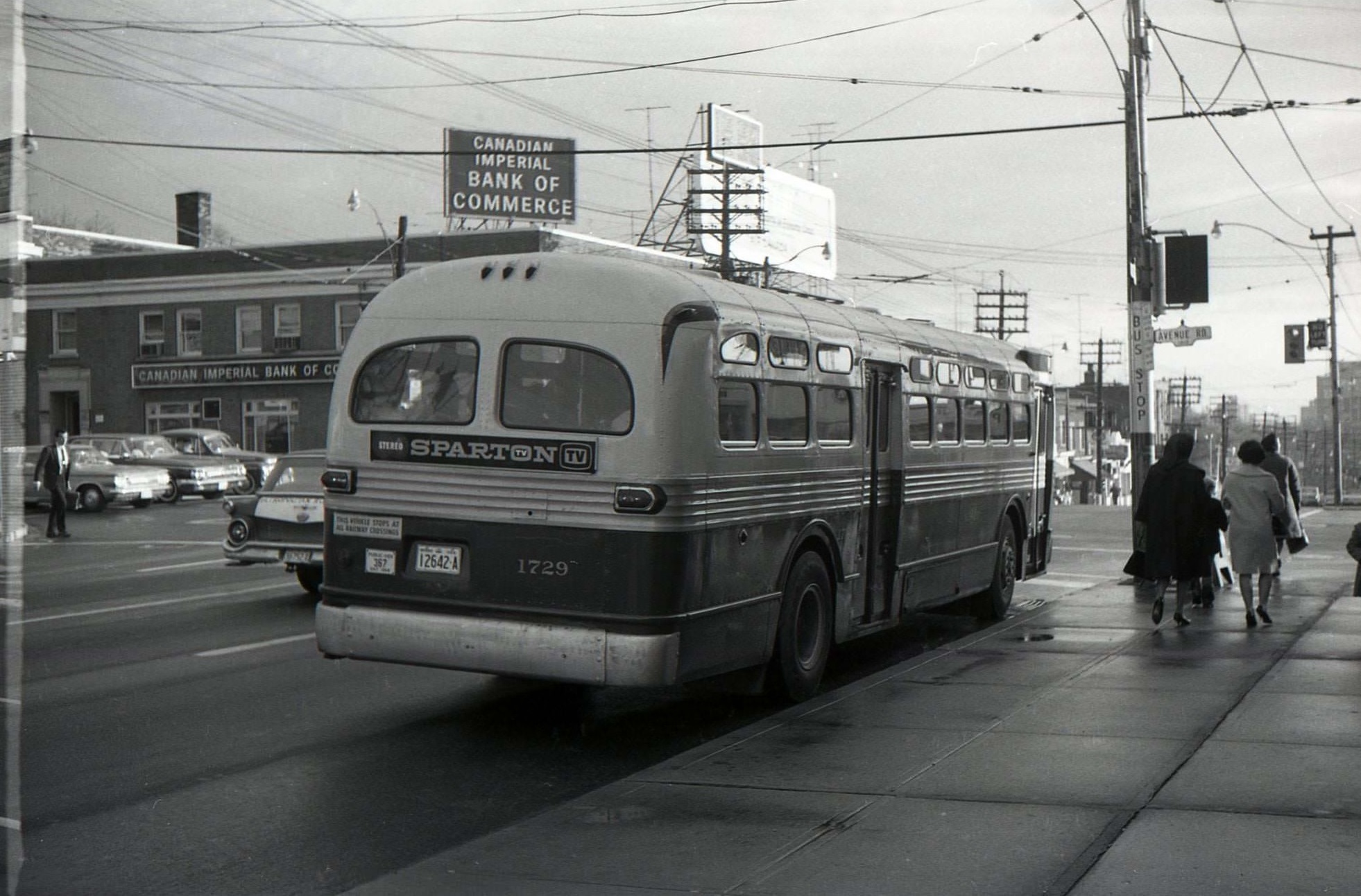 #71 TTC bus 1729 heading east along Eglinton Avenue West in 1964 at Avenue Road.