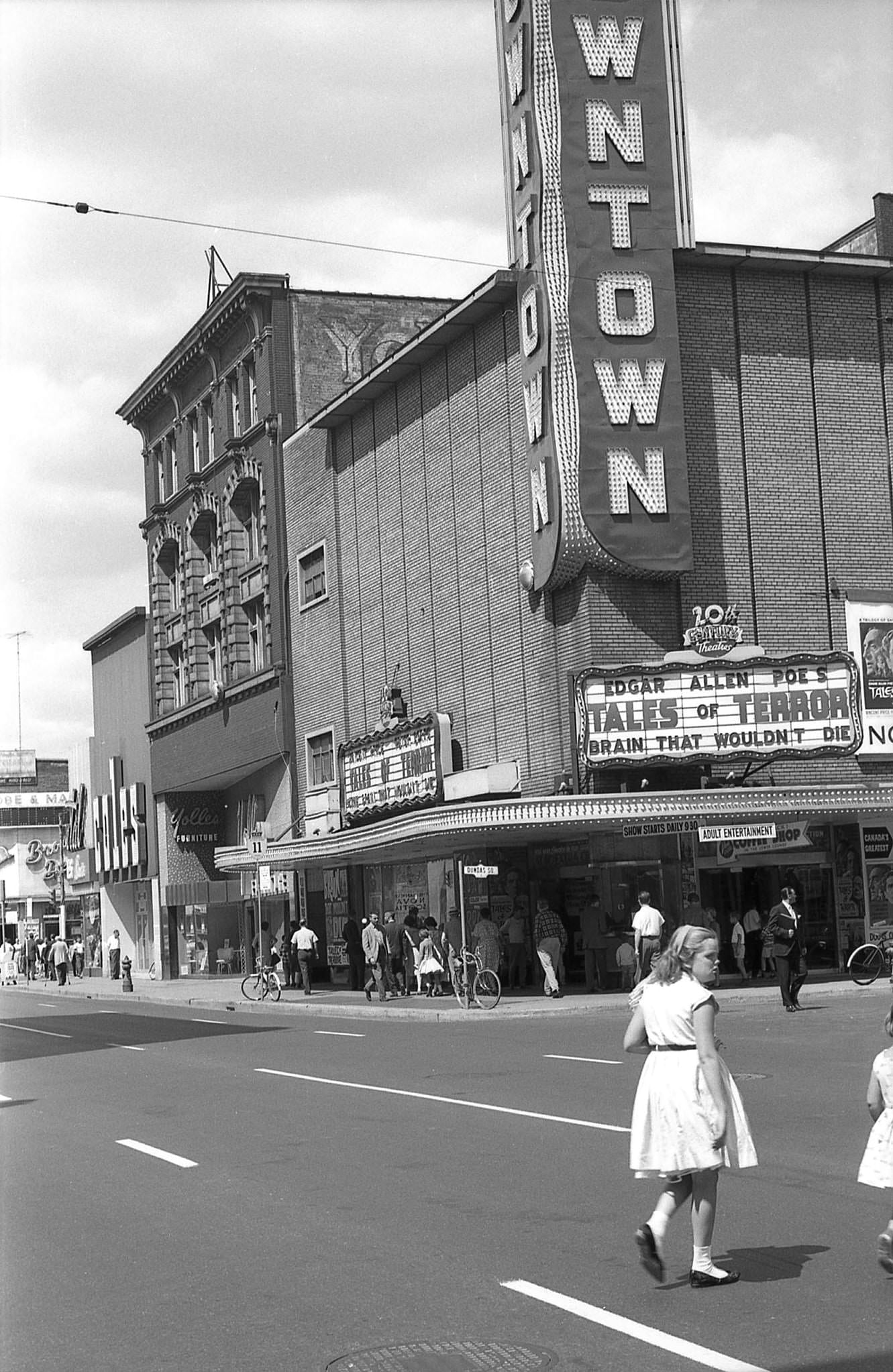 #79 Looking northeast on Yonge St. to the 1,059-seat Downtown Theatre, 1962.