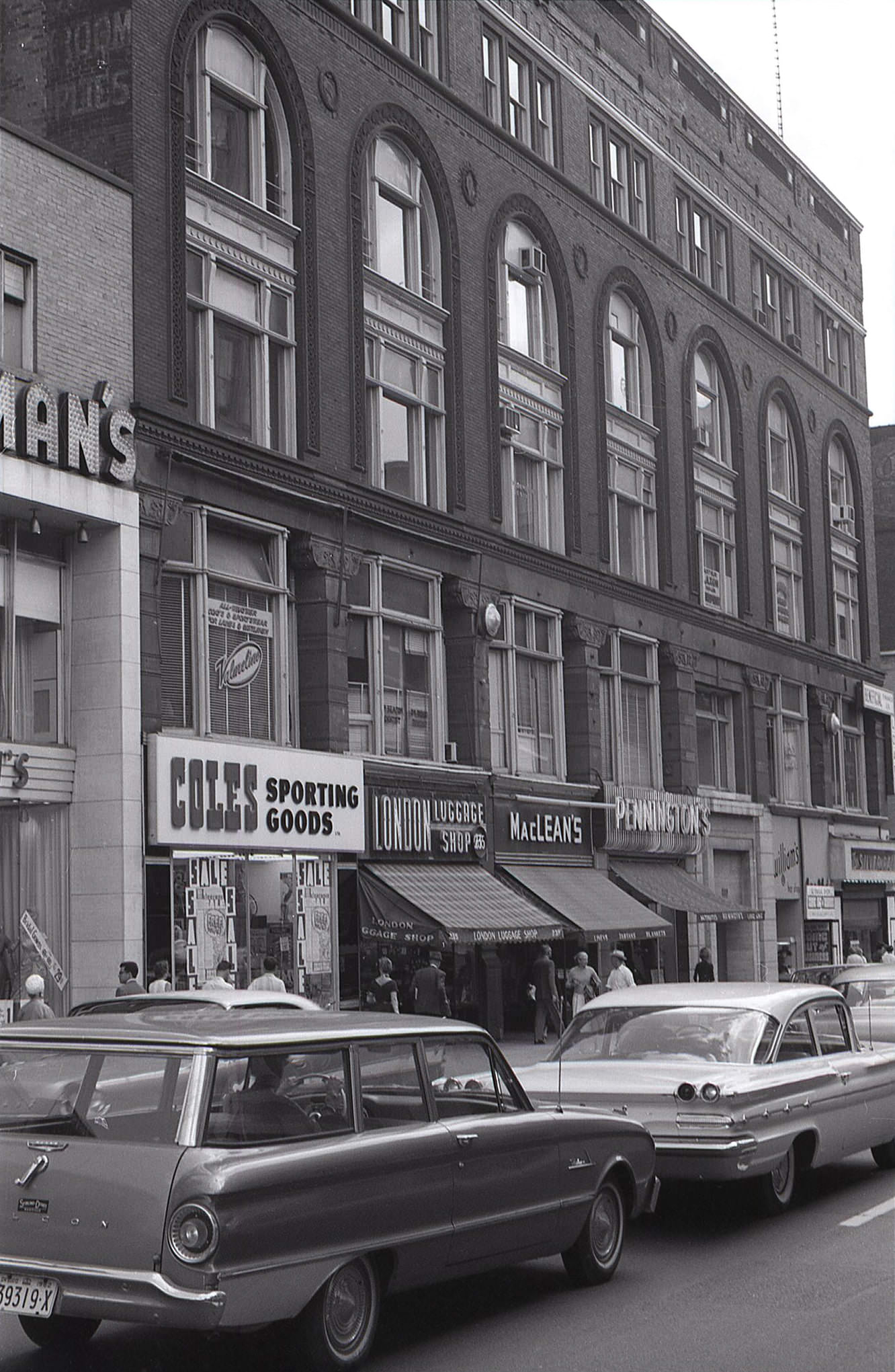 #85 Another look at the Ryrie Building on the northeast corner of Yonge and Shuter Streets, this time from the north, providing a good view of the ground floor shops in 1962.