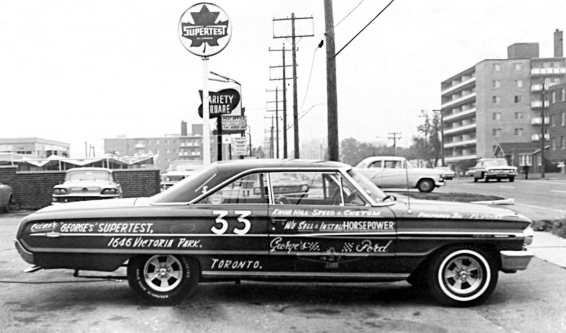 #90 Supertest at 1646 Victoria Park looking north. Zingburger behind the car. Apartment building on the right is 1651 V.P., 1960s