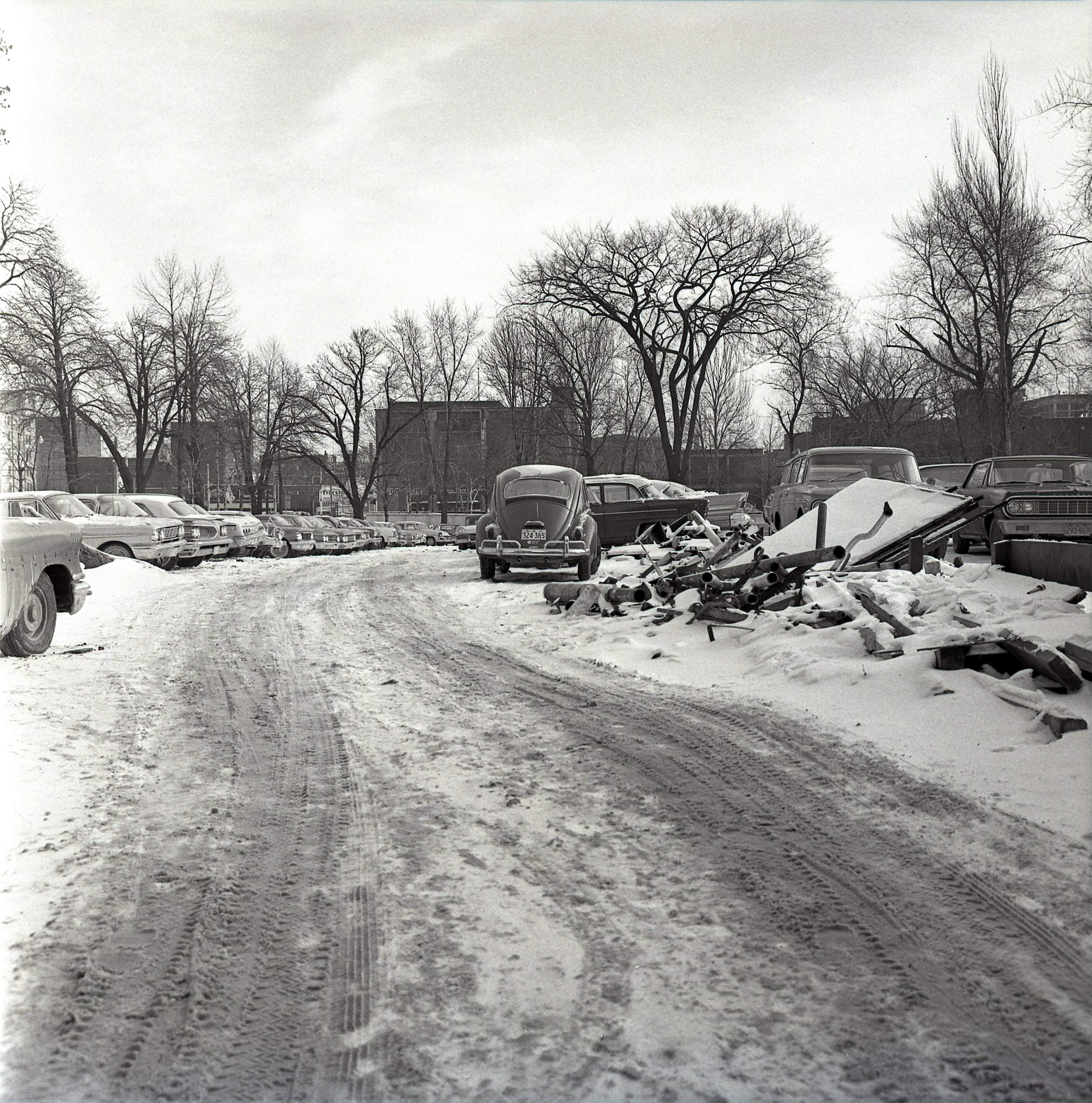 #101 The future Macdonald Block / 900 Bay Street site, looking east toward Bay. The building with the Studebaker sign in the distance is at 945 Bay, 1970s