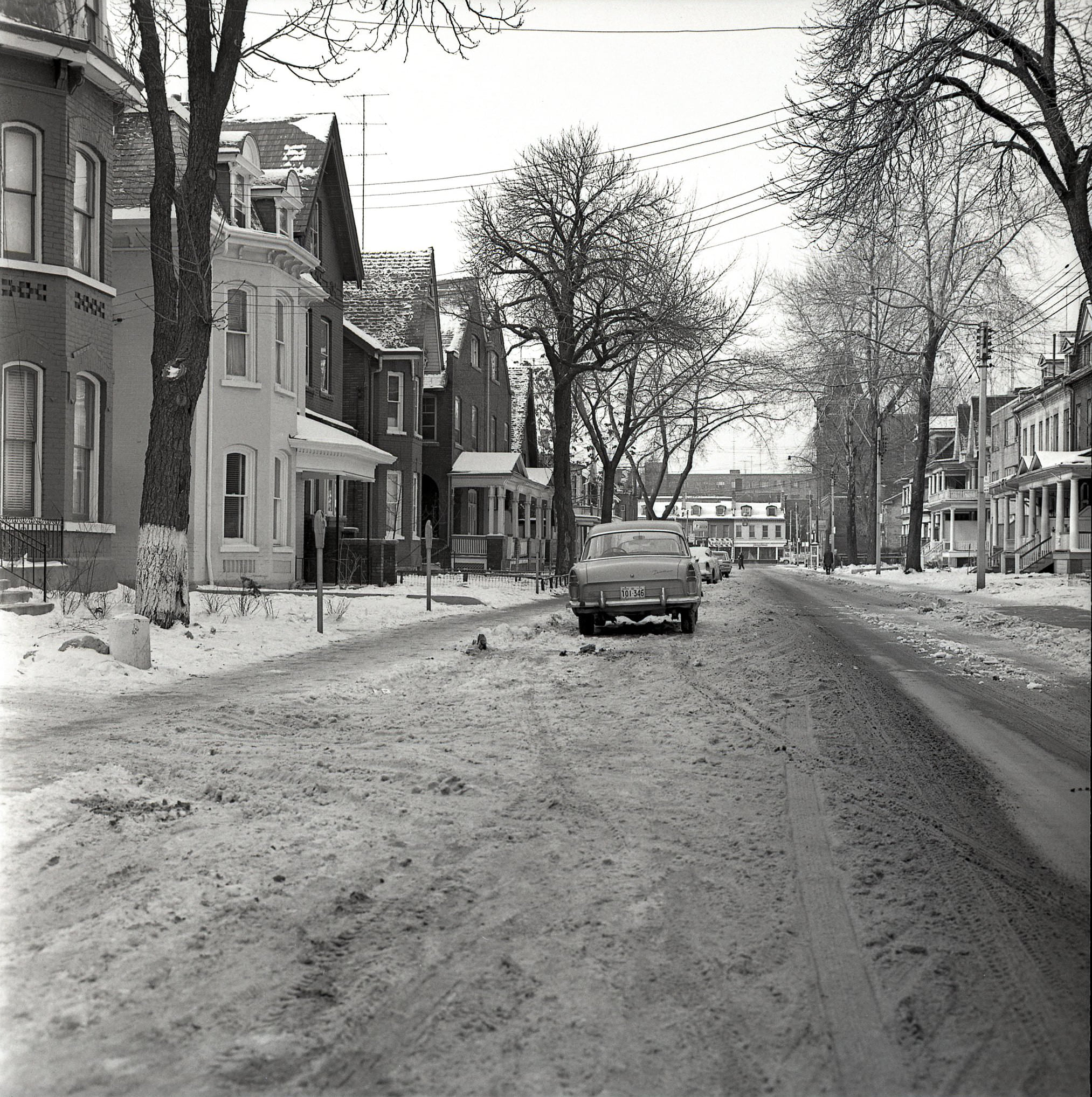 #92 Looking straight down Gloucester Street, out to Yonge, 1964.