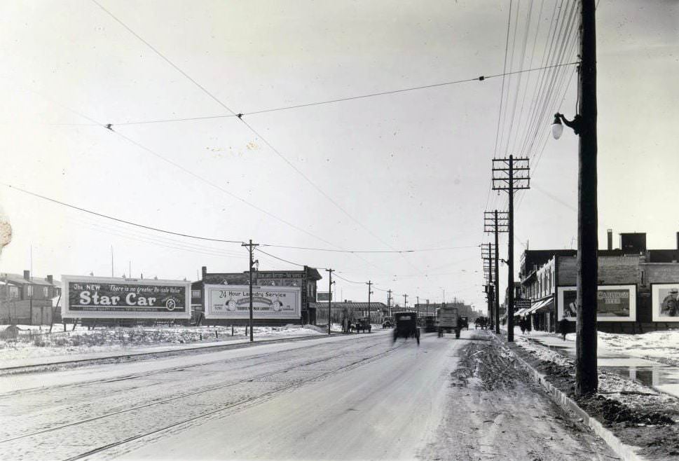 #18 Danforth Avenue, looking west towards Donlands Avenue. Visible in the image is Donlands Battery and Tire Service, 1920s