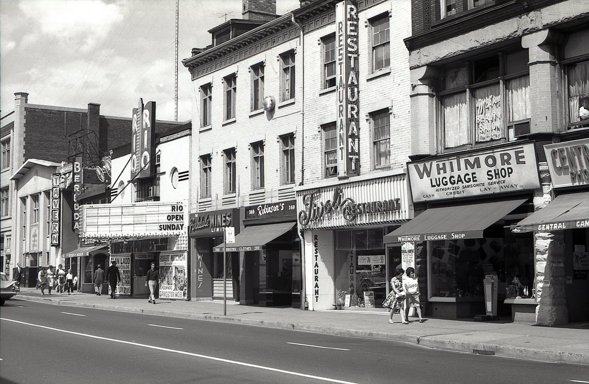 #25 Apart from the facade of the Yonge Street Mission, this stretch of streetscape no longer exists. East side of Yonge St. just south of Gerrard St., 1962.