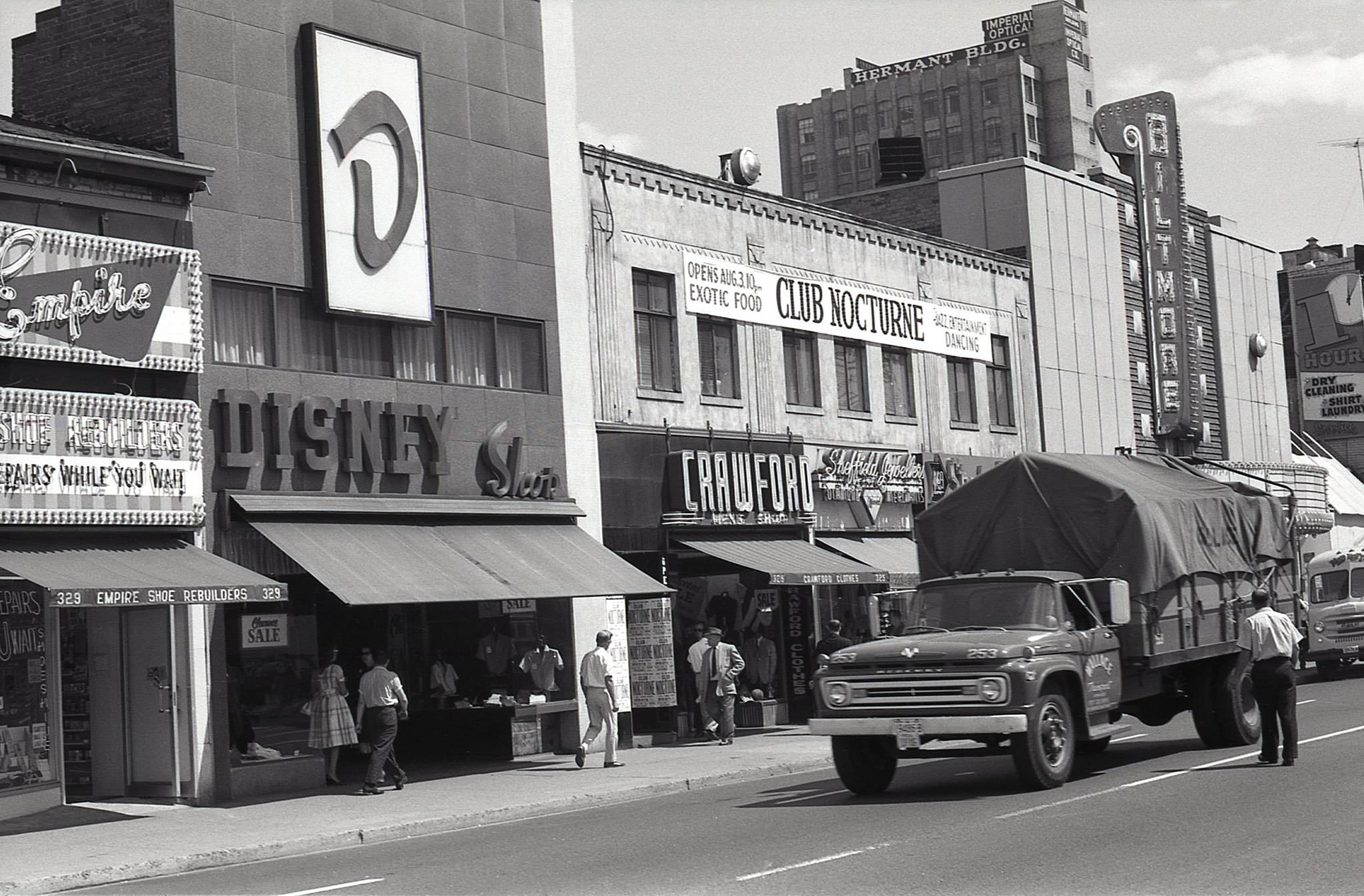 #26 A look back south towards the Biltmore Theatre, at 319 Yonge Street, 1962. Upstairs, at 321-325 Yonge, a sign indicating the opening of ‘Club Nocturne’