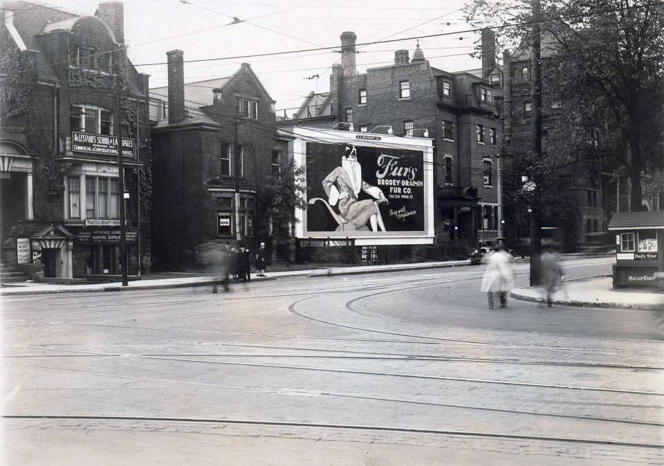 #58 South side of College Street, near Bay Street. Visible in the image is the De Lestard’s School of Languages, 53 College Street, and Marcella Beauty Parlour and Physicians & Surgeons Hospital Supplies, 1920s