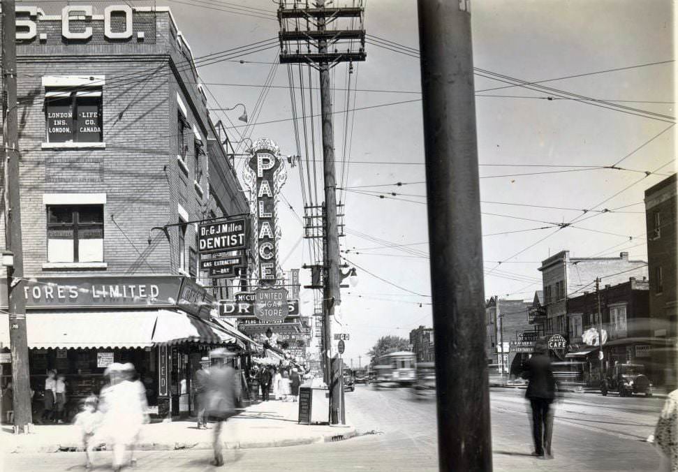 #62 Palace Theatre, 664 Danforth Avenue, near Pape Avenue, showing its overhanging electric sign. View is looking east on Danforth Avenue, from Pape Avenue, 1920s