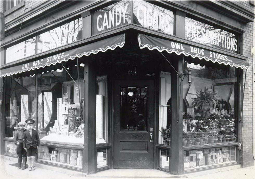 #64 Owl Drug Stores Limited. A signage on a storefront located at the north-west corner of Bloor Street West and Spadina Road, 1929