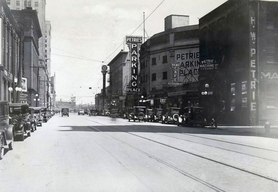 #65 Petrie’s Parking Place – Electric overhanging sign on a building located on the south side of Front Street West, west of York Street, 1929