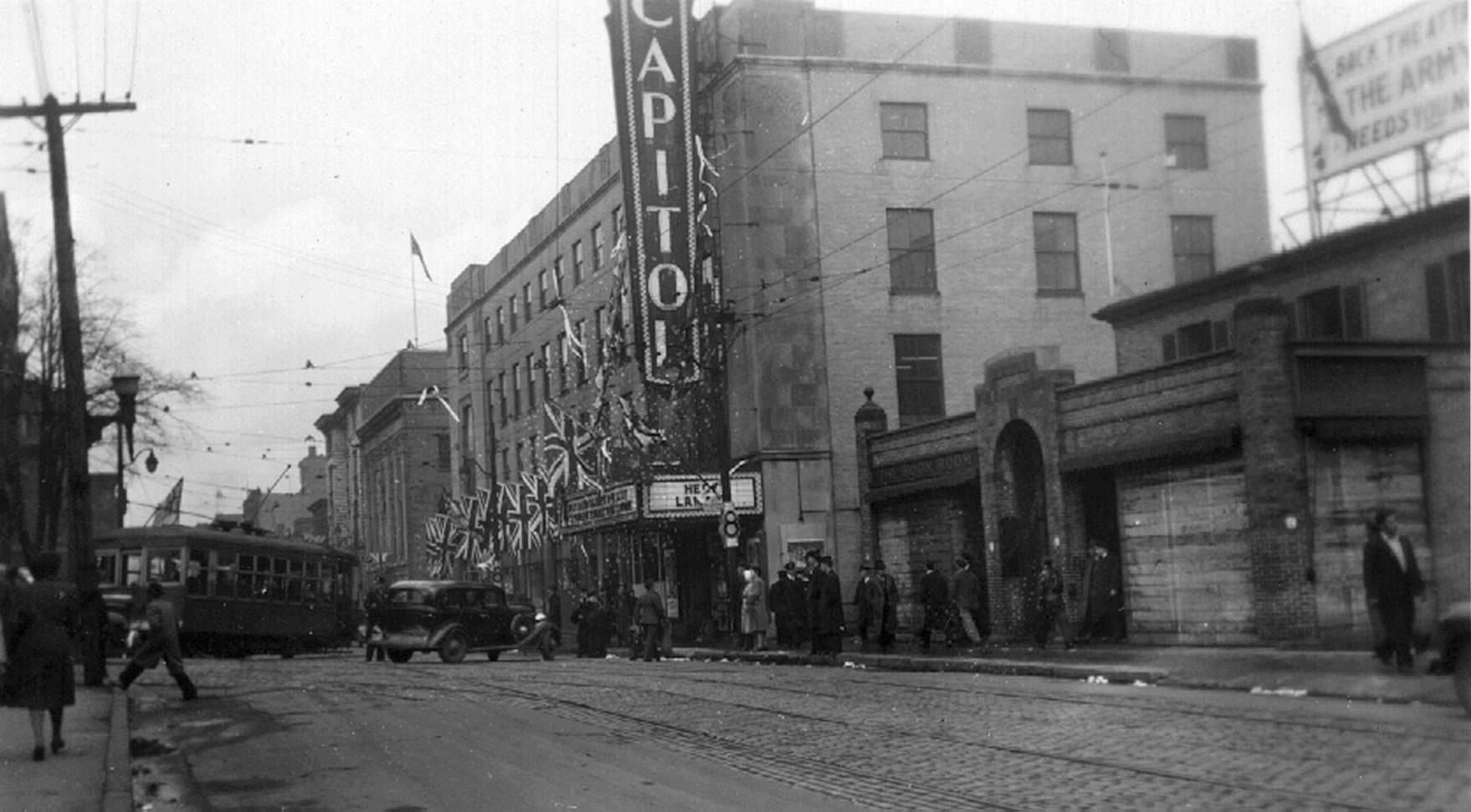 #32 Toronto Street scene, 1940s. The building on the near side of the theatre has “The Book Room” cast right into the facade.