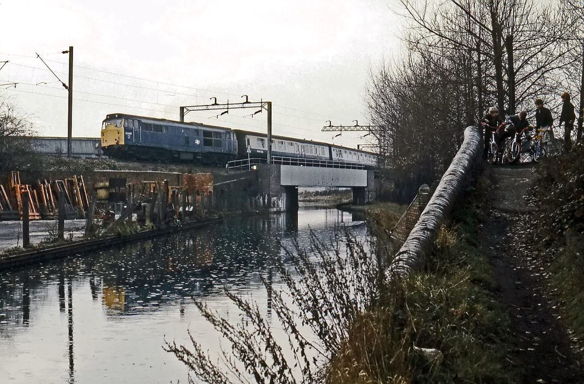 #18 Brush Type 2 No. 31401 crosses the Wyrley & Essington canal at Heath Town with up empty coaching stock on 20th November 1983.