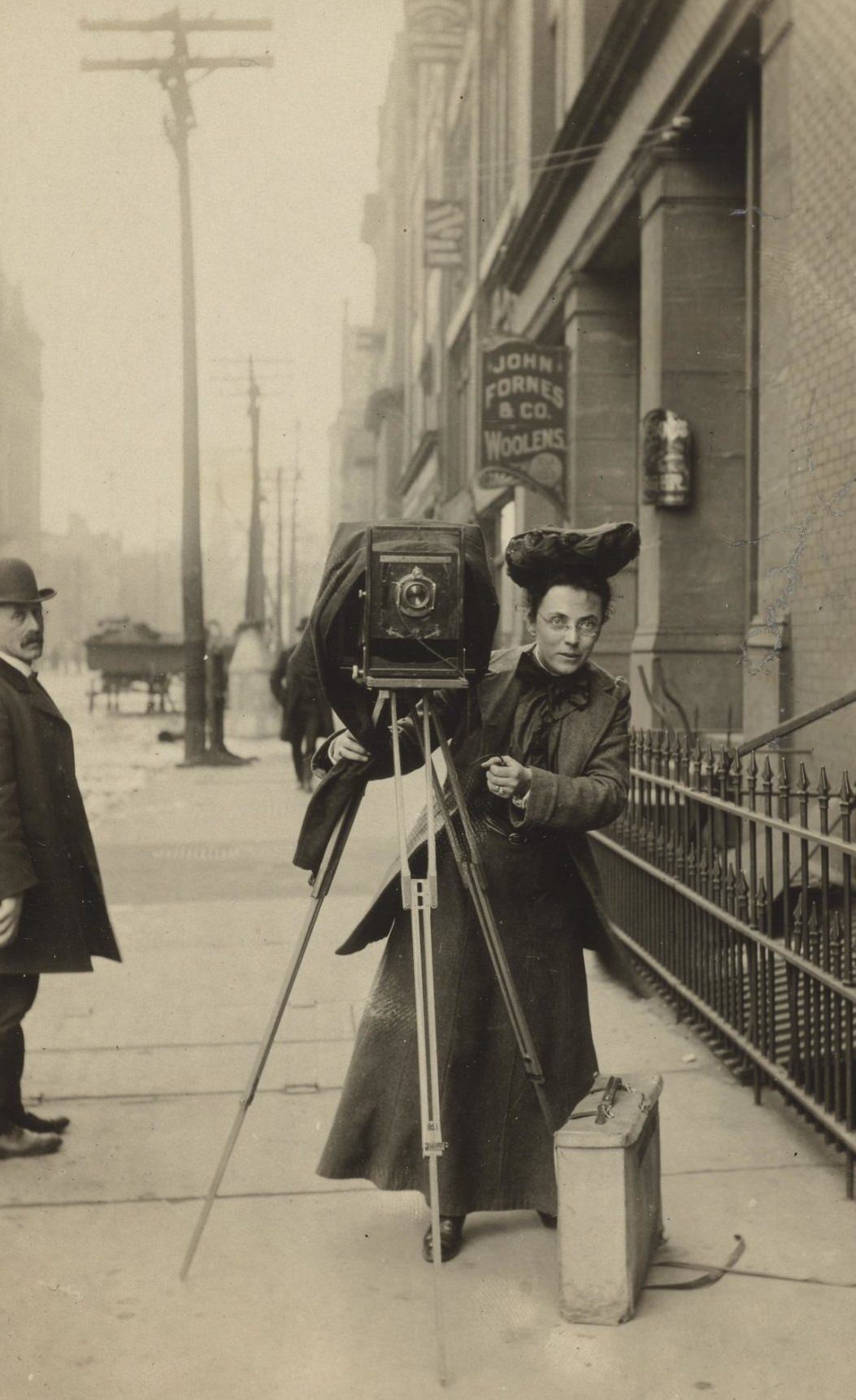 #1 Portrait of Jessie Tarbox Beals standing on a city sidewalk with her camera, 1920