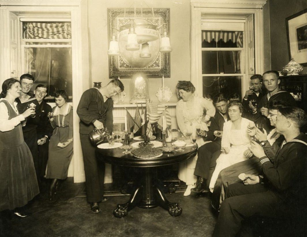 #28 Alice Foote MacDougal entertaining a group of sailors in her small apt in Old War