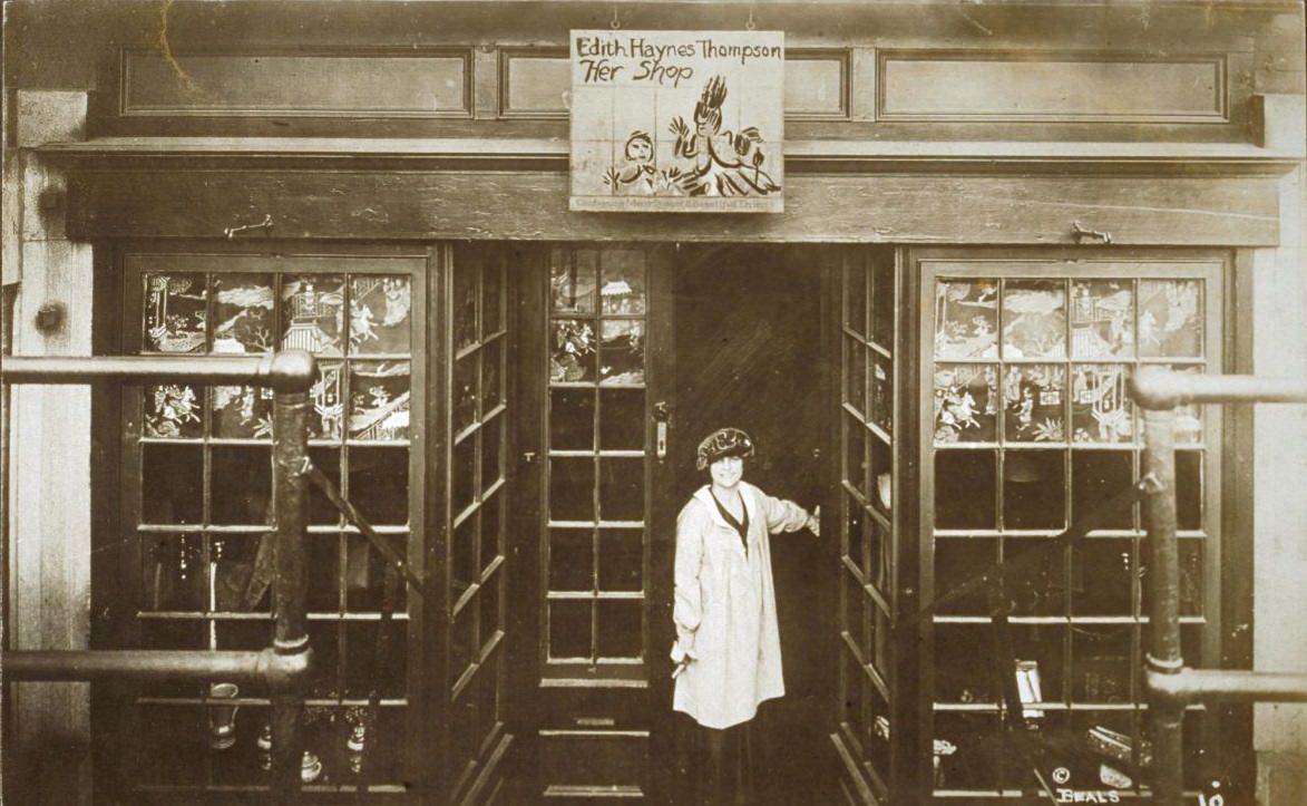#51 Edith Hayes Thompson standing in the doorway of Her Shop, 1920