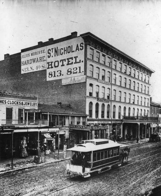 #25 Once one of old St. Louis’ better known hotels, on Fourth between Morgan (now Delmar) and Franklin, the St. Nicholas began losing its glory in the 1870s when this photo was made.