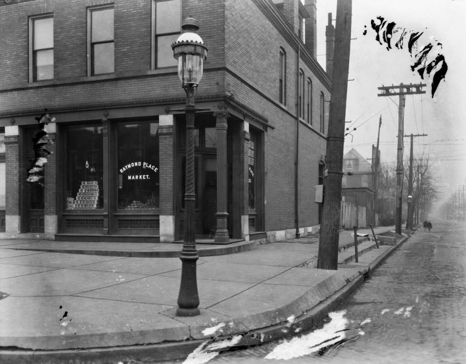 #72 View south down Academy Ave., showing the Raymond Place Market at the southeast corner of Page Blvd. and Academy Ave, 1925