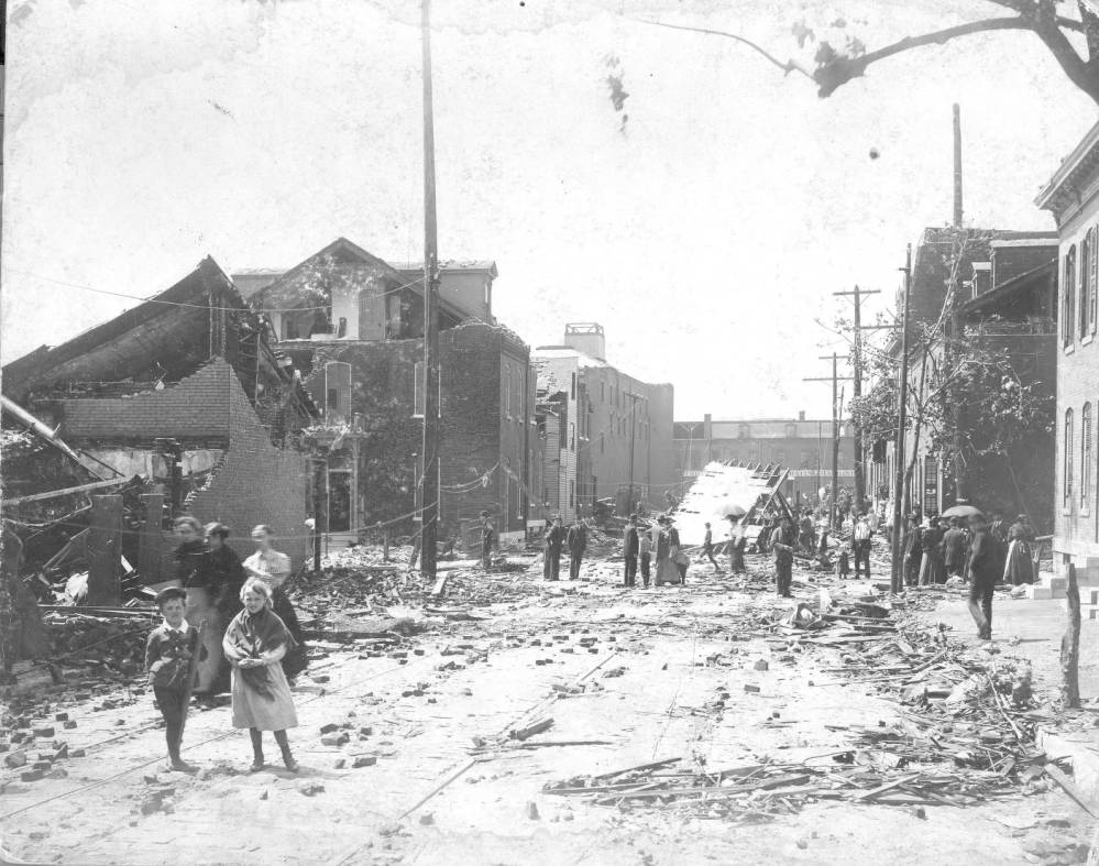 #3 This view looking south on 8th Street from Rutger Street shows people wandering through the rubble. The De La Vergne Refrigerating Machine Company on Park Avenue can be seen in the distance.
