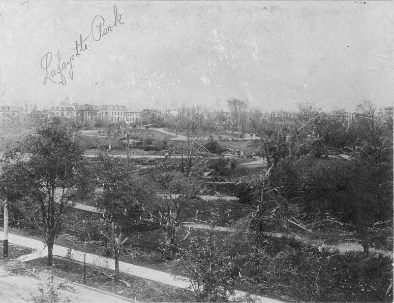 #38 The tornado did some of its worst damage in this neighborhood, destroying nearly all the trees in the park. Damaged houses on the surrounding streets of Lafayette Square can be seen in the distance.