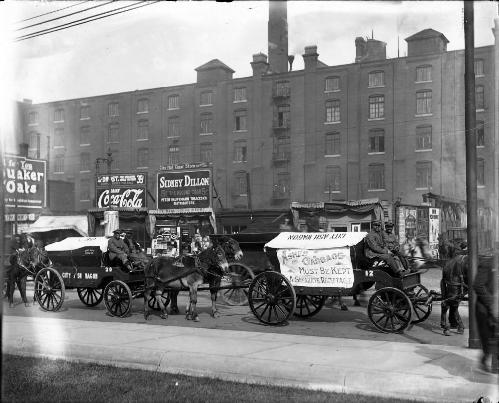 #15 Parade of St. Louis city ash wagons. Small businesses are visible in the background, 1910