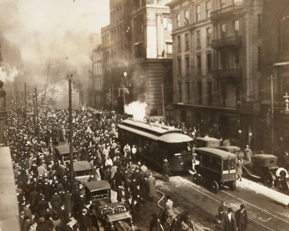 #49 A large group of onlookers watching firefighters battle a fire near the intersection of St. Charles Street and Broadway downtown, 1913