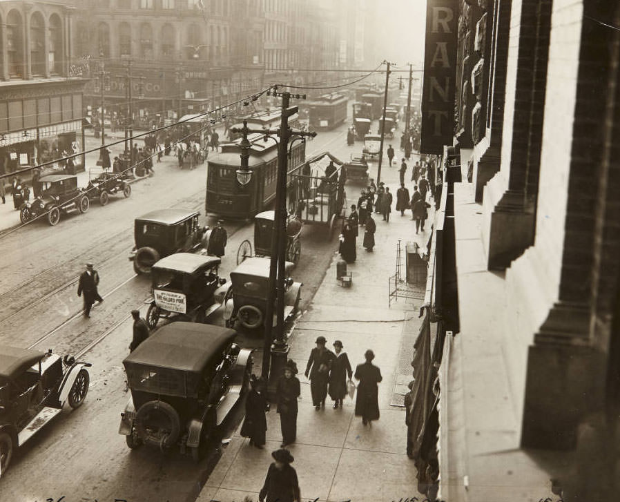 #55 A busy traffic scene looking south on Broadway near Washington Avenue, 1915